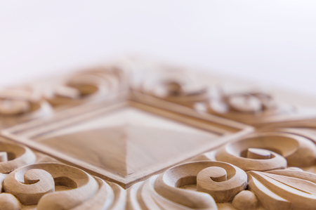 Wood processing. Joinery work. wood carving. the carving element. close up. small depth of field. use as backgroundの写真素材