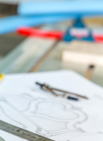 Wood processing. Joinery work. vintage pencil, compass, ruler and sketch by hand,  Wood Carving. blurredの写真素材