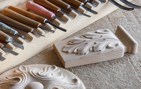 Wood processing. Joinery work. wood carving. the carving object with pattern, chisels for carving close up. small depth of field. use as backgroundの写真素材
