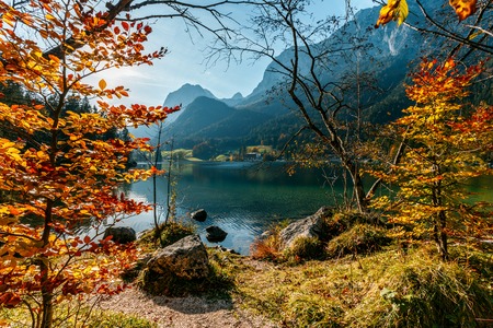 Wonderful Mountain lake at sunny day in Autumn. Picturesque Unusual Natural Landscape. Majestic Mounain Reflected in Water. Scenic view of the silent lake Hintersee in Ramsau, Germany. Postcardの写真素材
