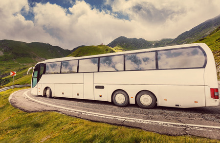 Touristic bus on the Transfagarasan road. Popular travel marshrout. Beauty in the world. Dangered and beautiful road in Europe, Romania Transfagarasan road, Ridge Fagaras.の写真素材