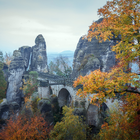 Awesome Autumn Landscape. Amazing misty Morning in Saxon Switzerland National Park near Dresden at the Elbe river. Unsurpassed sunrise in the mountains Saxon Switzerland. retro styleの写真素材