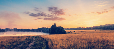 wonderful summer scenery.colorful sunrise over the lake and agriの写真素材