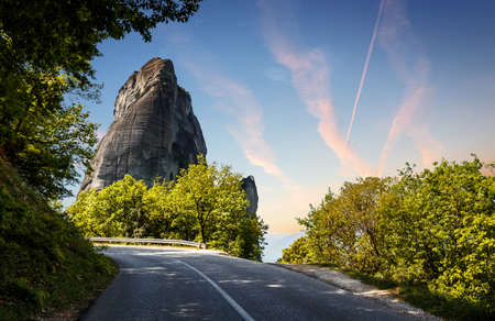 Scenic image of spring Landscape Meteora Greece. Stunning spring panoramic landscape. View at mountains and blossoming trees during sunrise. Wonderful nature sceneの写真素材