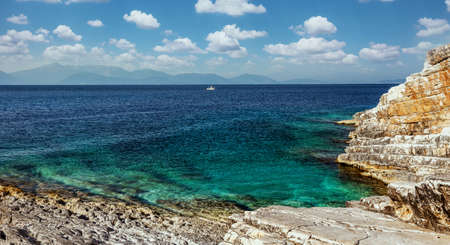Picturesque Greece landscape. Amazing cliff rocks on the west coast of Ionian sea. Wonderful summer seascape with perfect blue skyの写真素材