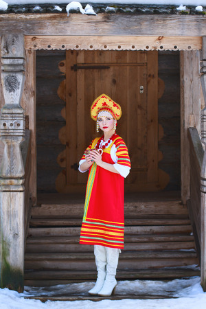 Russian girl drinking tea in the villageの写真素材