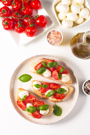Italian bruschetta with mozzarella, tomatoes and basilの写真素材