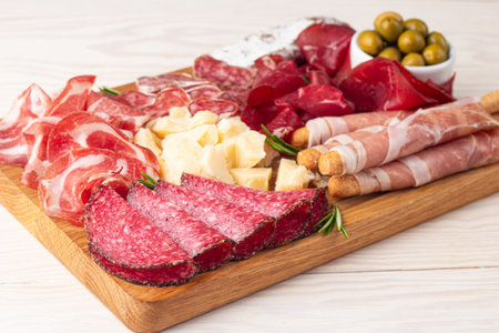Antipasto platter with salami, ham, cheese and olivesの写真素材