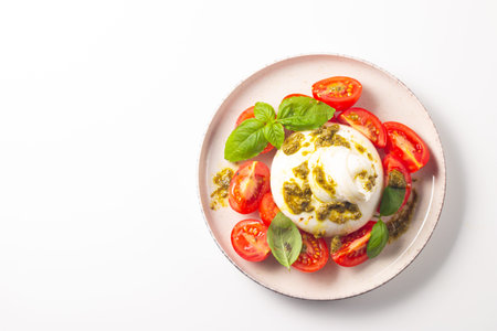 Caprese salad with mozzarella cheese, tomatoes and basil