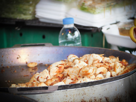 Nice seafood barbecue. Grilled squid on skewer.の写真素材