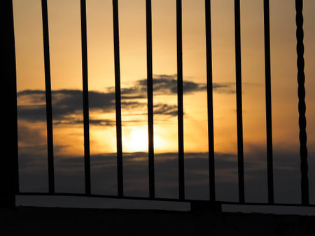 Focus The fence with beautiful light of sunset background.