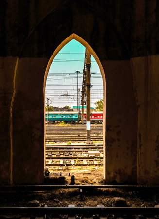 Ajmer, 21 December 2019: An indian Architectural gate with indian railway train standing outside.の写真素材