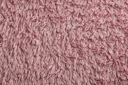 a background pattern showing the fabric of a pink towelの写真素材
