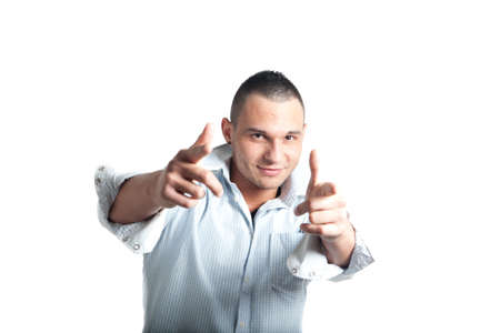 a young man wearing a shirt pointing with his fingers at the viewerの写真素材