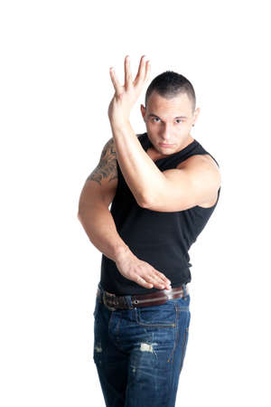 a casual dressed young man posing in a wing tsun stanceの写真素材