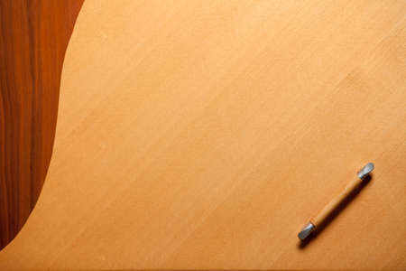 closeup of the door of some wooden furniture with copyspaceの写真素材