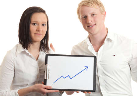closeup of two young businesspeople presenting a cliboard with a chart indicating  growthの写真素材