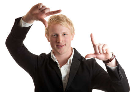 a young man framing his face with his handsの写真素材