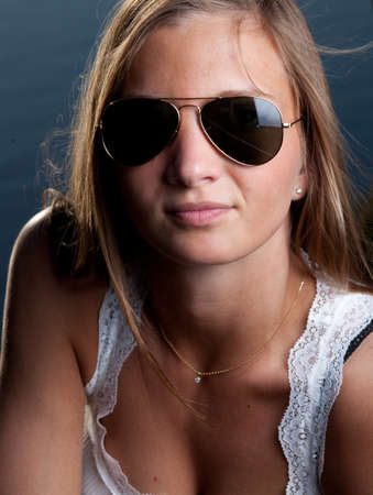 portrait of a young blonde woman with sunglassesの写真素材