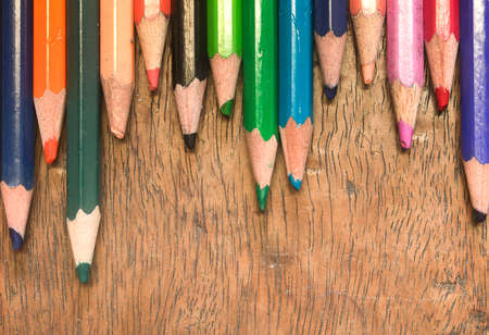 Color pencils point from the upside on wood backgroundの写真素材