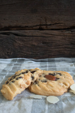 Chocolate chip cookie on the handkerchief on wooden background