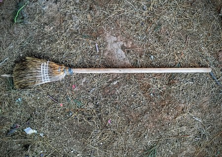 Old Broom lying in the dirt in an old cemetery in Arizonaの写真素材