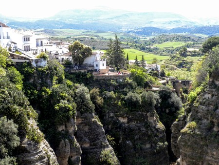 A view of the village of Ronda and the surrounding landscape mountains, gorge, Andalusia, Spain.の写真素材