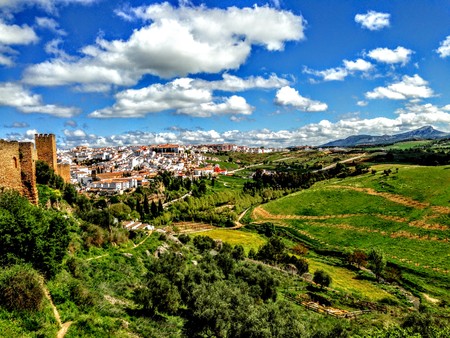Ronda, Spain old town cityscape on the Tajo Gorge city clouds and farming countrysideの写真素材