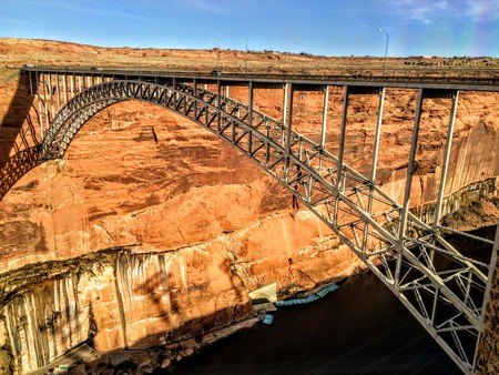 Glen Canyon Dam Bridge over the Colorado River sand stone walls traveling.の写真素材