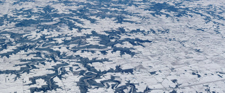 Aerial winter snow landscape view of rural and city land between Minneapolis Minnesota and...
