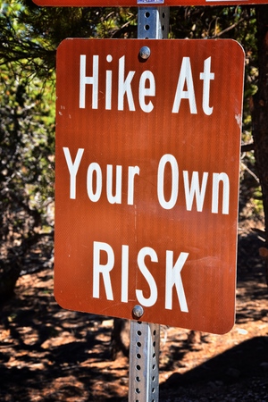 Kanarraville Falls sign directions, fees  and hike at your own risk rules from along the hiking trail of Waterfall in Kanarra Creek Canyon by Zion National Park, Utah, USA.の写真素材
