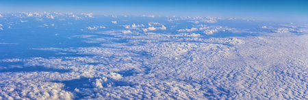 Aerial Cloudscape view over midwest states on flight over Colorado, Kansas, Missouri, Illinois,...