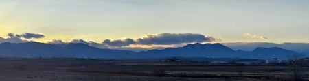 Views from the Cradleboard Trail walking path on the Carolyn Holmberg Preserve in Broomfield Colorado surrounded by Cattails, wildlife, plains and Rocky mountain landscape during fall close to winter. United States.の写真素材
