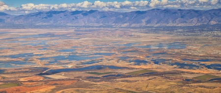Aerial view of Wasatch Front Rocky Mountain landscapes on flight over Colorado and Utah during winter. Grand sweeping views near the Great Salt Lake, Utah Lake, Provo, Timpanogos, Lone and Twin Peaks mountain and landscape patterns. Top view, Utah, USA.の写真素材