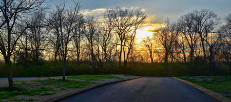 Dusk Sunset views through winter tree branches by Opryland along the Shelby Bottoms Greenway and Natural Area Cumberland River, Nashville, Tennessee. United States.の写真素材