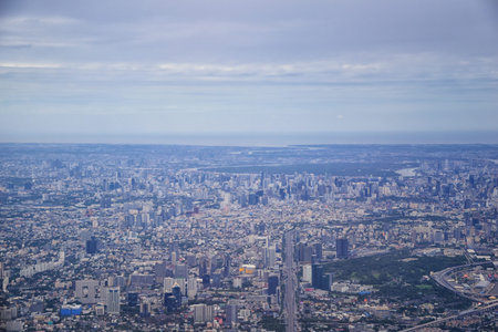 Aerial view of Bangkok Thailand and surrounding landscape, modern office buildings, condominium,...