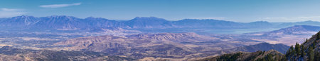 Wasatch Front Rocky Mountain landscapes from Oquirrh range looking at Utah Lake during fall....