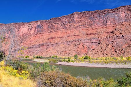 Moab Panorama views of Colorado River Highway UT 128  in Utah around  Hal and Jackass canyon and Red Cliffs Lodge on a Sunny morning in fall. Scenic nature near Canyonlands and Arches  National Park, Utah. United States.の写真素材