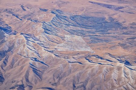 Colorado Rocky Mountains Aerial view from airplane of abstract Landscapes, peaks, canyons and rural cities in southwest Colorado and Utah. United States of America. USA.の写真素材