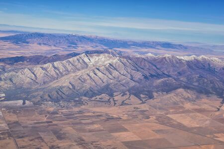 Rocky Mountains, Oquirrh range aerial views, Wasatch Front Rock from airplane. South Jordan, West Valley, Magna and Herriman, by the Great Salt Lake Utah. United States of America. USA.の写真素材