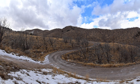 Snowy Hiking Trail views towards Lake Mountains Peak via Israel Canyon road towards Radio Towers in winter, Utah Lake, Wasatch Front Rocky Mountains, Provo, United States.の写真素材