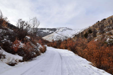 Snowy Hiking Trail views towards Lake Mountains Peak via Israel Canyon road towards Radio Towers in winter, Utah Lake, Wasatch Front Rocky Mountains, Provo, United States.の写真素材