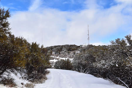 Snowy Hiking Trail views towards Lake Mountains Peak via Israel Canyon road towards Radio Towers in winter, Utah Lake, Wasatch Front Rocky Mountains, Provo, United States.の写真素材