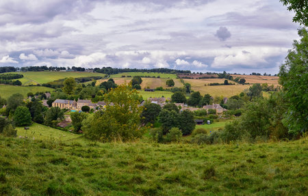 England lush pastures and farmlands in the United Kingdom. Beautiful English countryside with emerald green fields and meadows. UK.の写真素材