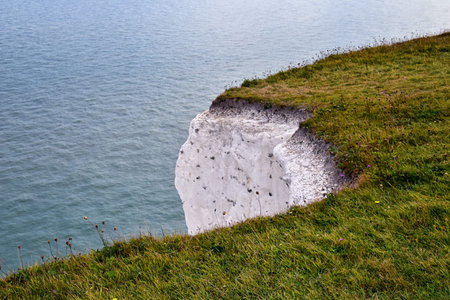 White Cliffs of Dover. Close up detailed landscape view of the cliffs from the walking path by the...