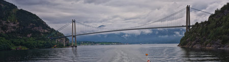 Norway Coast Fjord view from boat on ocean. Mountains, forests, and small towns. Scandinavia, Norway