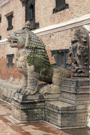 Statue of mythical beast guarding the entrance to the Royal Palace in the Durbar Square, Bhaktapur,...