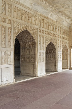 Detail of richly carved marble walls and arches decorating a Mughal Palace inside the Red Fort, Agraの写真素材