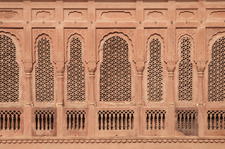 Elaborately carved red sandstone windows of Junagarh Fort, Bikaner, Rajasthan, Indiaの写真素材