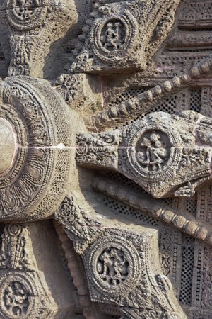 Detail of erotic carving decorating the spokes of a chariot wheel on the ancient Surya Hindu Temple at Konark, Orissa, India. 13th Century ADの写真素材